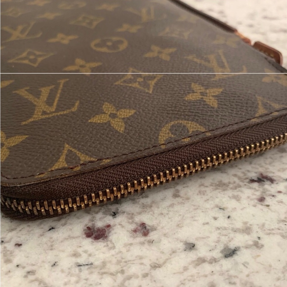 Authentic Louis Vuitton Monogram travel zip clutch or wallet.